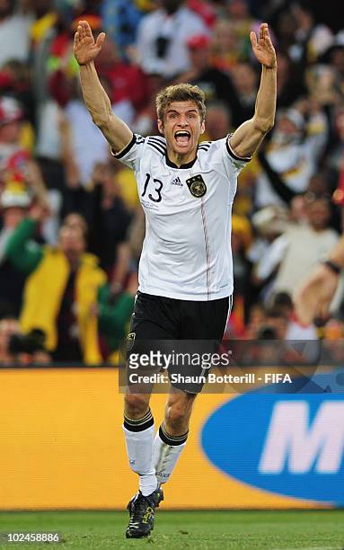 Thomas Mueller of Germany celebrates scoring during the 2010 FIFA World Cup South Africa Round of Sixteen match between Germany and England at Free...