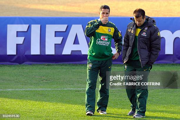 Brazil's coach Dunga and assistant Jorginho take part in a training session at Randburg High School in Johannesburg on June 27, 2010 during the 2010...