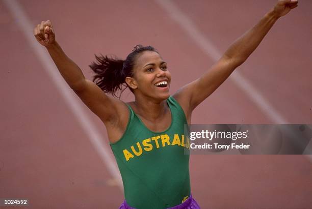 Cathy Freeman of Australia celebrates after winning the 400 metres final during the Commonwealth Games in Victoria, Canada. Freeman won the gold...