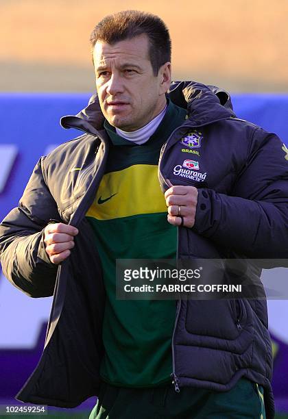 Brazil's coach Dunga adjusts his jacket during a training session at Randburg High School in Johannesburg on June 27, 2010 during the 2010 World Cup...
