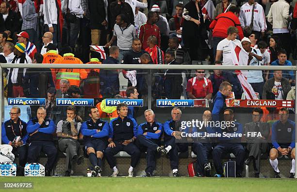 David Beckham of England , Fabio Capello manager of England and Stuart Pearce of England look on dejected after the 2010 FIFA World Cup South Africa...