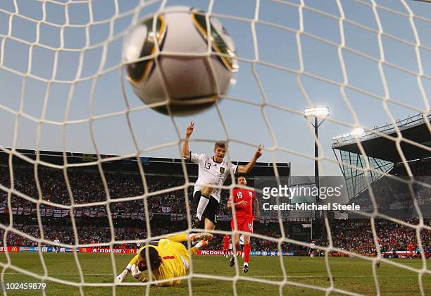 Thomas Mueller of Germany celebrates scoring his teams fourth past goal David James of England during the 2010 FIFA World Cup South Africa Round of...