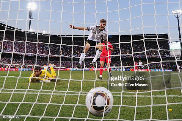 Thomas Mueller of Germany scores his teams fourth past goal David James of England during the 2010 FIFA World Cup South Africa Round of Sixteen match...