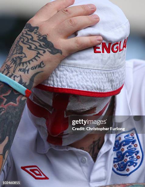 Fans react as they watch England lose 4-1 to Germany on a giant screen in the Manchester fan zone. On June 27, 2010 in Manchester, England. England...