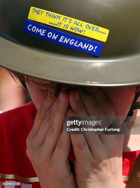 Fans react as they watch England lose 4-1 to Germany on a giant screen in the Manchester fan zone. On June 27, 2010 in Manchester, England. England...