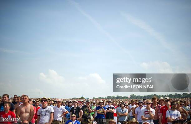 English football fans watch a broadcast of the England vs Germany World Cup match on the final day of the Glastonbury festival near Pilton, Somerset...