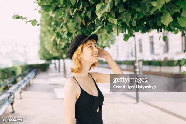 young woman eating leaves - extreme dieting stock pictures, royalty-free photos & images