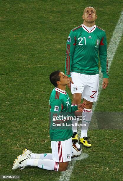 Javier Hernandez and Adolfo Bautista of Mexico prepare to kick off during the 2010 FIFA World Cup South Africa Round of Sixteen match between...