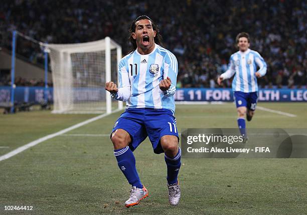 Carlos Tevez of Argentina celebrates scoring during the 2010 FIFA World Cup South Africa Round of Sixteen match between Argentina and Mexico at...