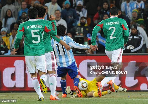 Argentina's striker Carlos Tevez scores a goal past Mexico's goalkeeper Oscar Perez during the 2010 World Cup round of 16 match Argentina vs Mexico...