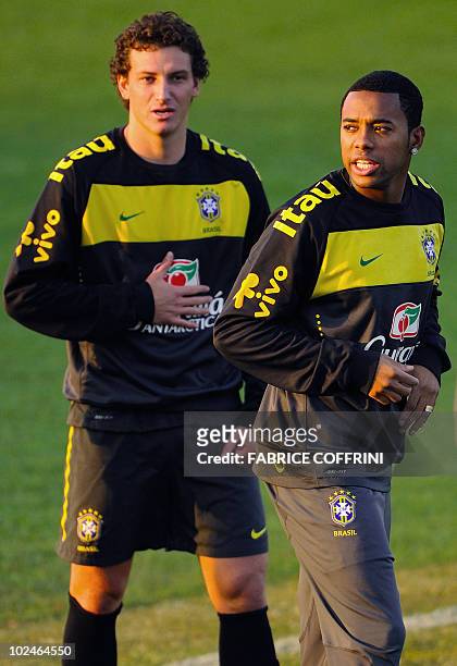 Brazil's striker Robinho and teammate Elano take part in a training session at Randburg High School in Johannesburg on June 27, 2010 during the 2010...