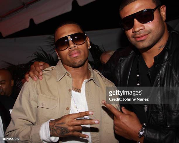 Chris Brown and NFL player Shawne Merriman at The Playboy Mansion on June 26, 2010 in Beverly Hills, California.