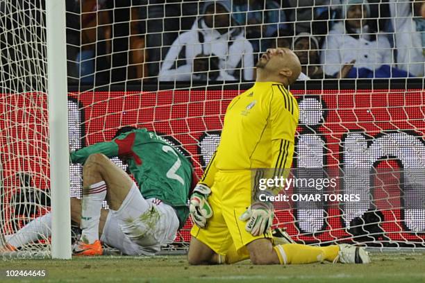 Mexico's goalkeeper Oscar Perez reacts after missing a goal by Argentina's striker Gonzalo Higuain during the 2010 World Cup round of 16 match...