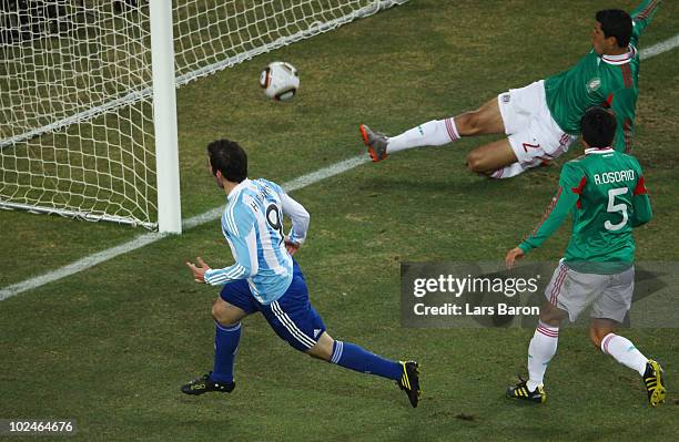 Gonzalo Higuain of Argentina scores the second goal for his team during the 2010 FIFA World Cup South Africa Round of Sixteen match between Argentina...