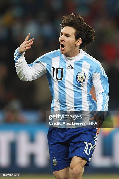 Lionel Messi of Argentina celebrates Carlos Tevez scoring during the 2010 FIFA World Cup South Africa Round of Sixteen match between Argentina and...