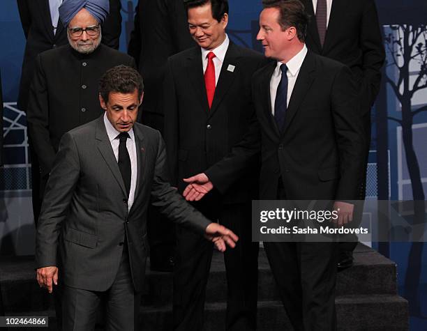 French President Nicolas Sarkozy, President Nguyen Minh Triet, Prime Minister of the United Kingdom David Cameron along with other world leaders pose...