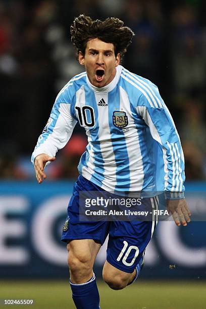 Lionel Messi of Argentina celebrates Carlos Tevez scoring during the 2010 FIFA World Cup South Africa Round of Sixteen match between Argentina and...