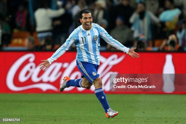 Carlos Tevez of Argentina celebrates scoring his second goal and his side's third during the 2010 FIFA World Cup South Africa Round of Sixteen match...