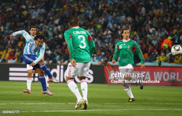 Carlos Tevez of Argentina scores the third goal for his team during the 2010 FIFA World Cup South Africa Round of Sixteen match between Argentina and...