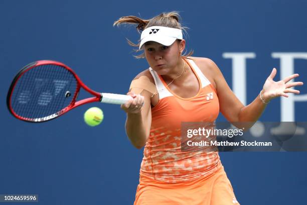 Evgeniya Rodina of Russia returns the ball during her women's singles first round match against Sloane Stephens of the United States on Day One of...