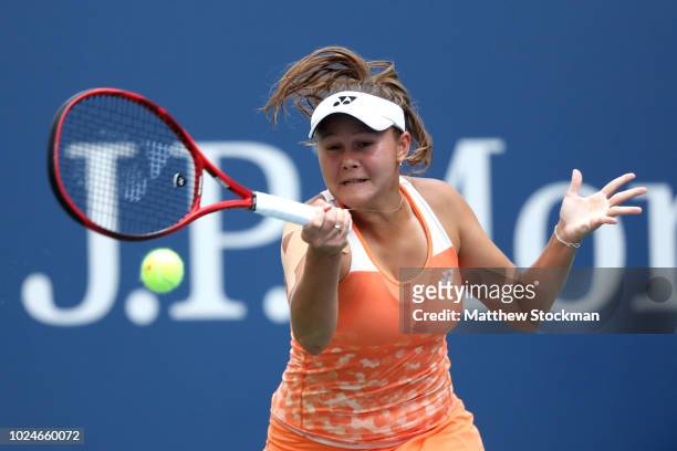 Evgeniya Rodina of Russia returns the ball during her women's singles first round match against Sloane Stephens of the United States on Day One of...