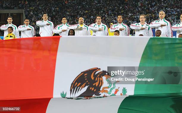 The Mexico team line up for their national anthem during the 2010 FIFA World Cup South Africa Round of Sixteen match between Argentina and Mexico at...