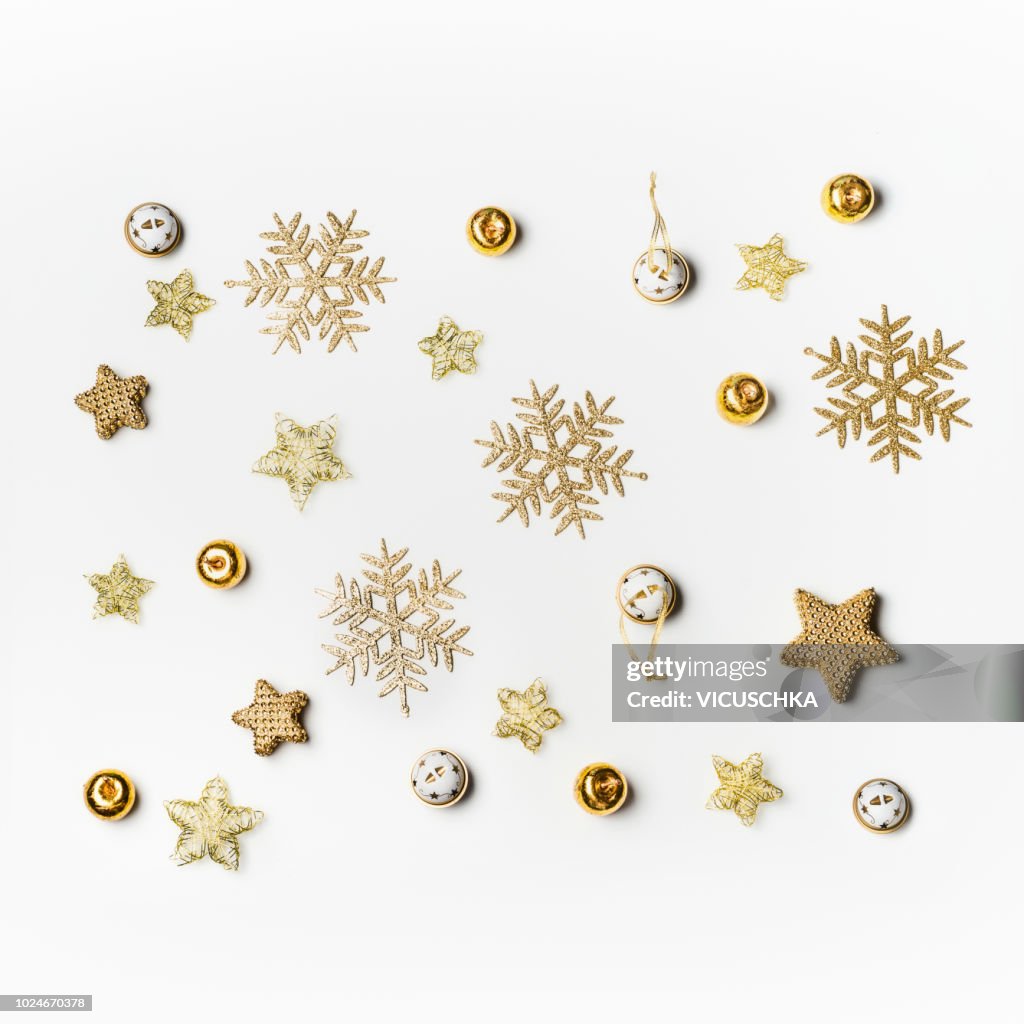 Christmas background with gold snowflakes on white