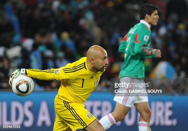 Mexico's goalkeeper Oscar Perez puts the ball back into play during the 2010 World Cup round of 16 football match Argentina vs. Mexico on June 27,...