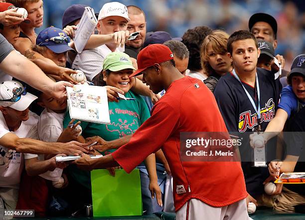 Pitcher Edwin Jackson of the Arizona Diamondbacks signs autographs just prior to the start of the game against the Tampa Bay Rays at Tropicana Field...