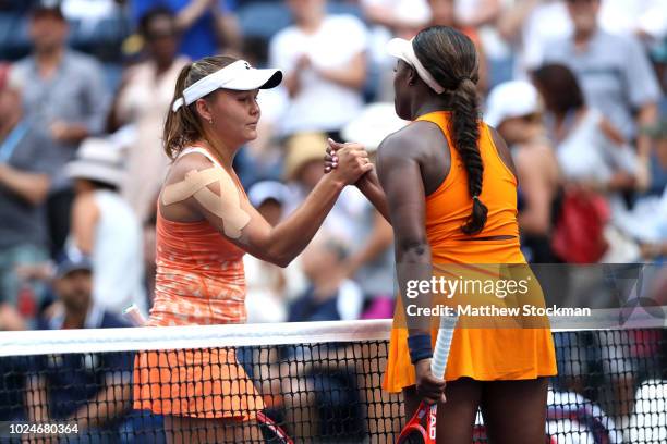 Sloane Stephens of the United States shakes hands with Evgeniya Rodina of Russia after defeating her in the women's singles first round match on Day...