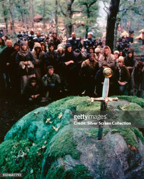 The sword in the stone from Arthurian legend, in a scene from the fantasy film 'Excalibur', 1981.