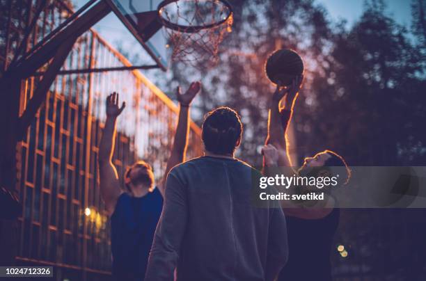 basketball game - street games stock pictures, royalty-free photos & images