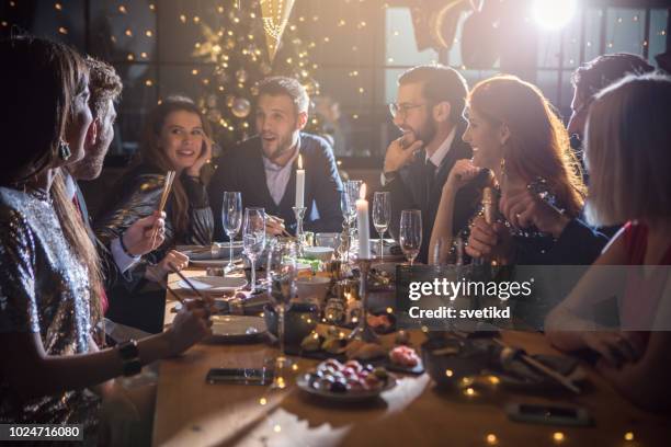 new year dinner party - new years eve dinner stock pictures, royalty-free photos & images