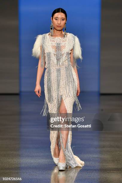 Model walks the runway in a design by Cecilia Kang Couture during the New Generation Emerging Couture show during New Zealand Fashion Week 2018 at...