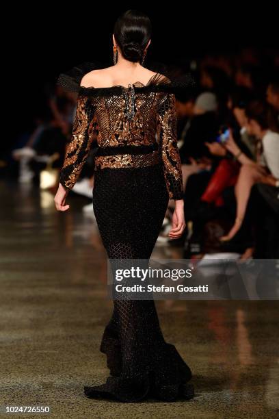 Model walks the runway in a design by Cecilia Kang Couture during the New Generation Emerging Couture show during New Zealand Fashion Week 2018 at...