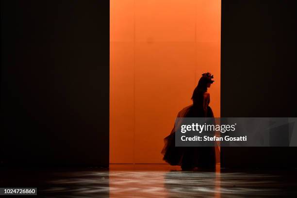 Model walks the runway in a design by Ruscoe during the New Generation Emerging Couture show during New Zealand Fashion Week 2018 at Viaduct Events...