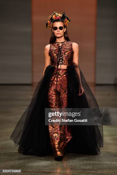 Model walks the runway in a design by Ruscoe during the New Generation Emerging Couture show during New Zealand Fashion Week 2018 at Viaduct Events...