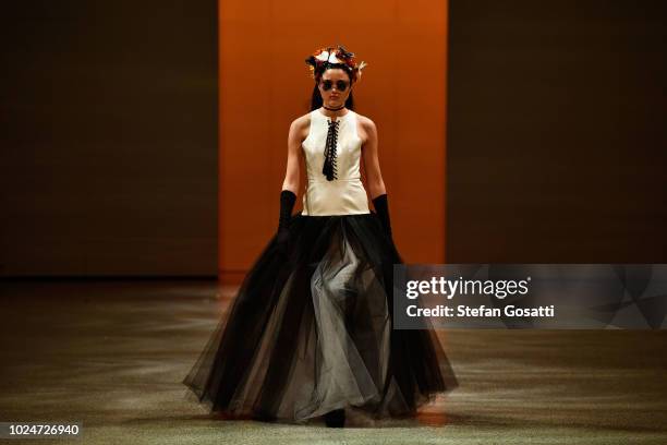 Model walks the runway in a design by Ruscoe during the New Generation Emerging Couture show during New Zealand Fashion Week 2018 at Viaduct Events...