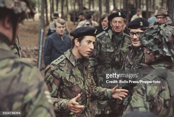 Prince Charles pictured in centre talking to British Army soldiers and officers during a visit to Osnabruck Garrison at Osnabruck in West Germany on...