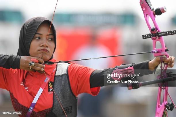 Indonesia's Choirunisa Diananda in action during the Archery Recurve Women's Individual Final Asian Games 18th against China's Zhang Xinyan at...