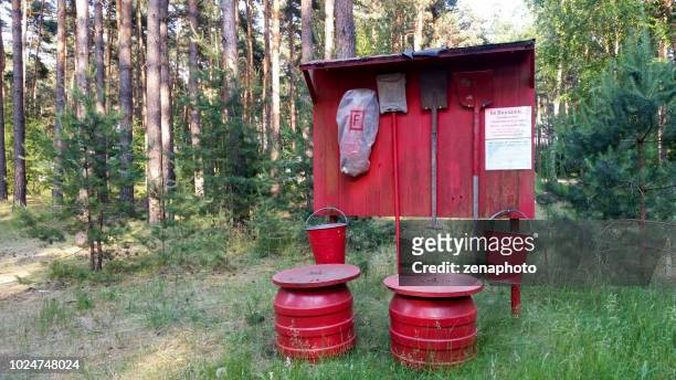 red fire prevention equipment in forest - fire prevention stock pictures, royalty-free photos & images