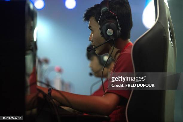The Indonesian team competes in the eSports round 6 match 1 as an exhibition sport at the 2018 Asian Games in Jakarta on August 28 ahead of its entry...