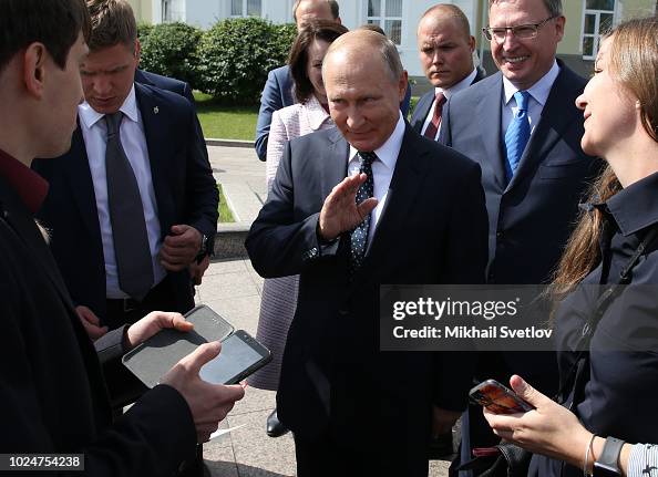 Putin Wave Russian President Vladimir Putin waves during his meeting with local ...