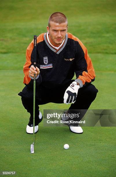 David Beckham surveys a putt during the England football team golf day at Barewood Lakes Golf Course in Berkshire, England. \ Mandatory Credit: Ross...