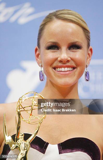 Actress Julie Berman poses with the Outstanding Younger Actress Award in the trophy room at the 37th Annual Daytime Entertainment Emmy Awards held at...