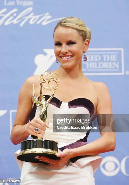 Actress Julie Berman poses with the Outstanding Younger Actress Award in the trophy room at the 37th Annual Daytime Entertainment Emmy Awards held at...