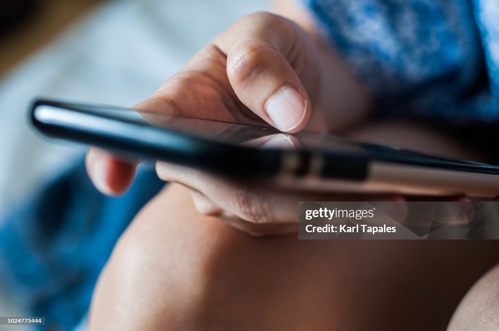 A woman is using a mobile phone