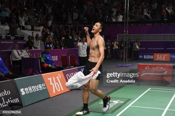 Indonesia's Jonatan Christie celebrates his victory against Chou Tienchen from Chinese Taipei in men's singles badminton gold medal match at Istora...