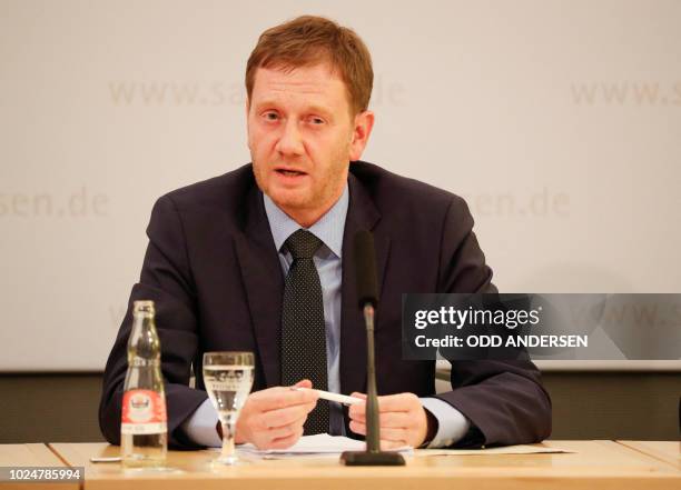 Minister President of Saxony, Michael Kretschmer, holds a press conference, following the events of Chemnitz, on August 28, 2018 in Dresden, eastern...