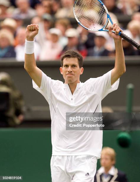 Tim Henman of Great Britain celebrates his five-sets Men's Singles first round victory over Carlos Moya of Spain on day two of the Wimbledon Lawn...